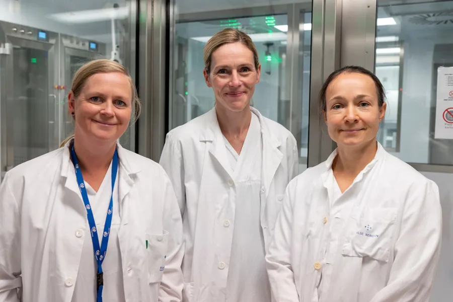 A group of women in white lab coats