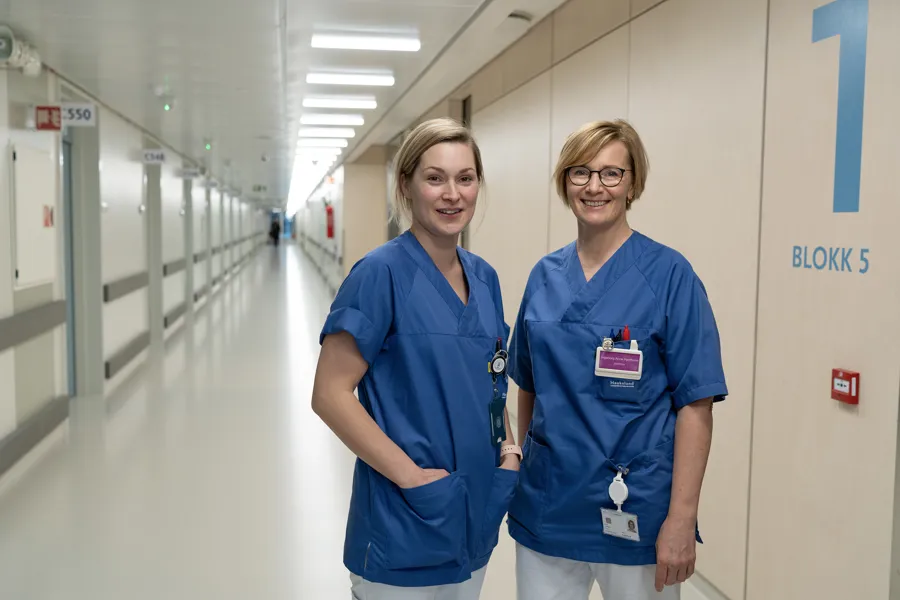 A couple of women in blue shirts